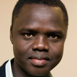 Valentino Achak Deng - hoofdpersoon in Eggers' 'Wat is de Wat?' - wordt Minister van Onderwijs